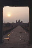 A distant temple framed by a dark doorway