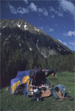 A mountain campsite beneath rocky peaks