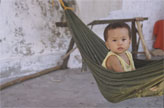 A child sitting in a hammock