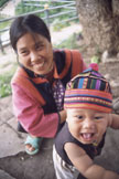 An adult and child looking toward the camera