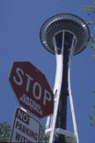 A street sign beneath the Space Needle
