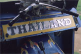 The word Thailand painted across the back of a vehicle